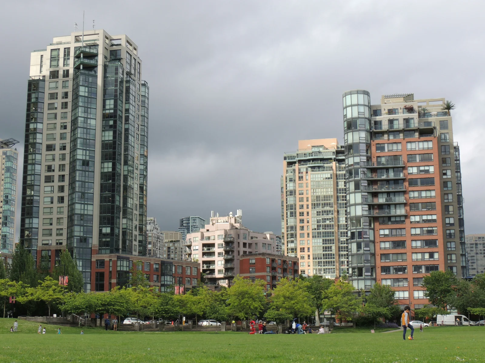 Yaletown residential towers overlooking a green public park in Vancouver
